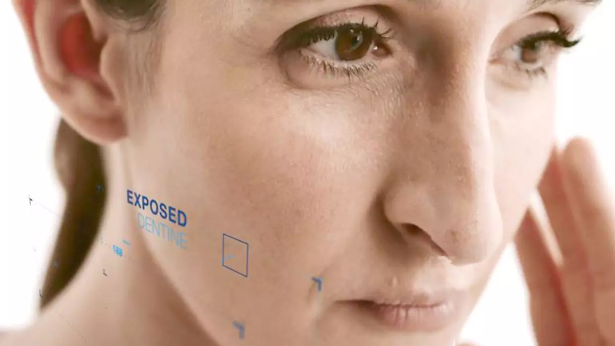 $imgtitle Woman touching cheek after experiencing sudden tooth pain